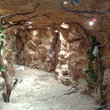 Отделка искусственным, декоративным камнем помещения подземного прохода в виде грота. - п. Сходня, МО, частный объект - 2010г.